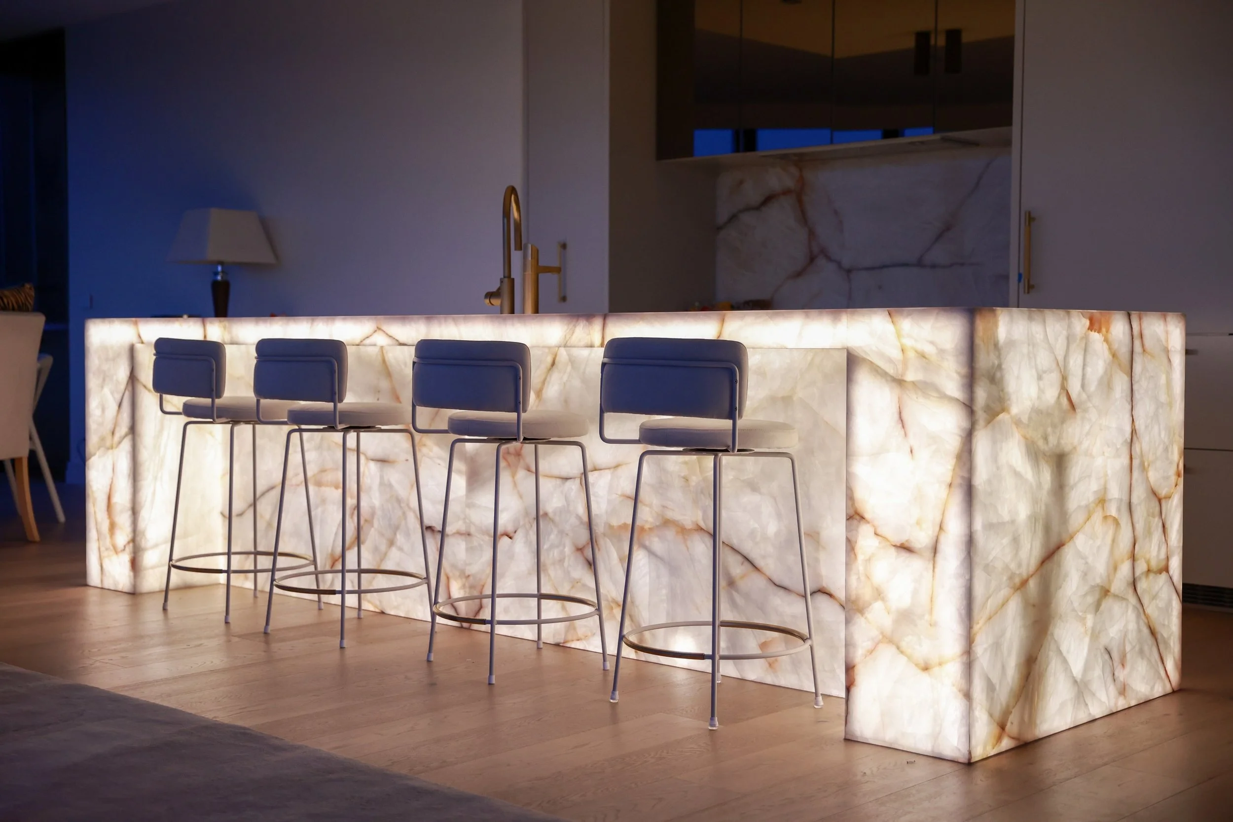 Exterior at dusk with warm interior light spilling out