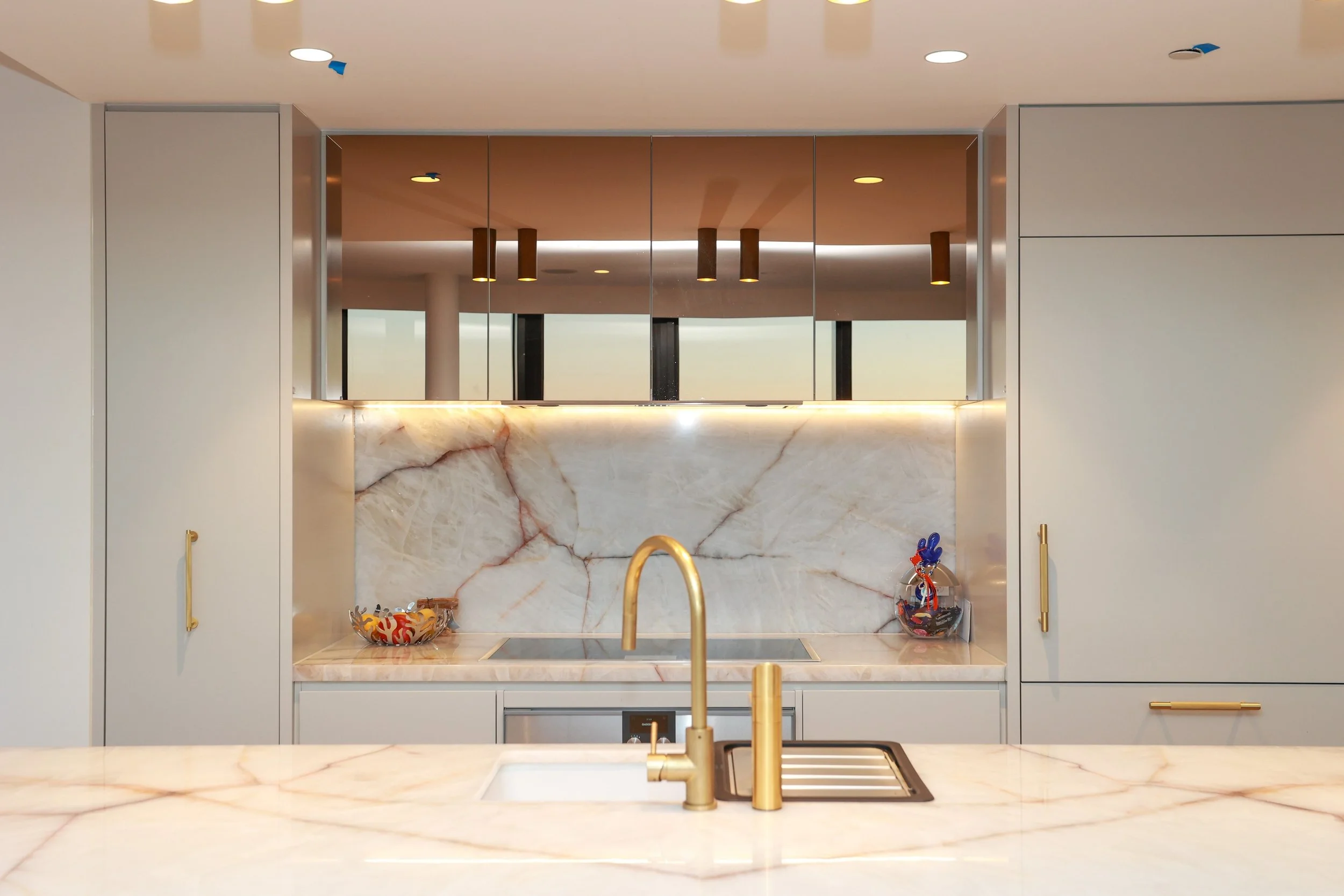 Open kitchen with island and stainless steel range