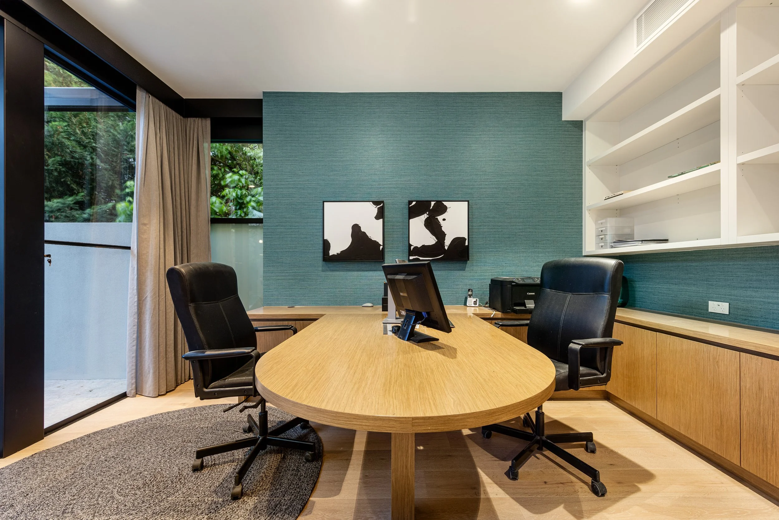 A Small Homes Victoria interior showing large openings and timber surfaces
